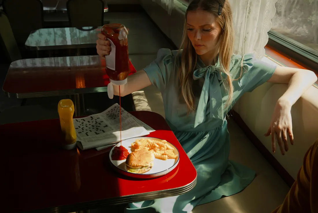 Woman at a retro diner table