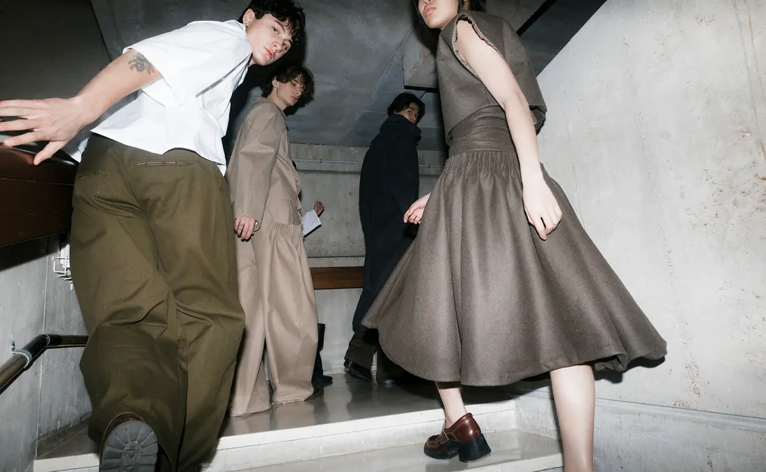 Couple in fashion outfits on a staircase